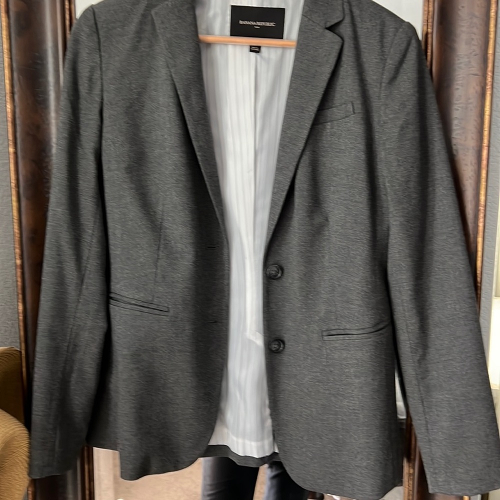 Gray suit blazer.